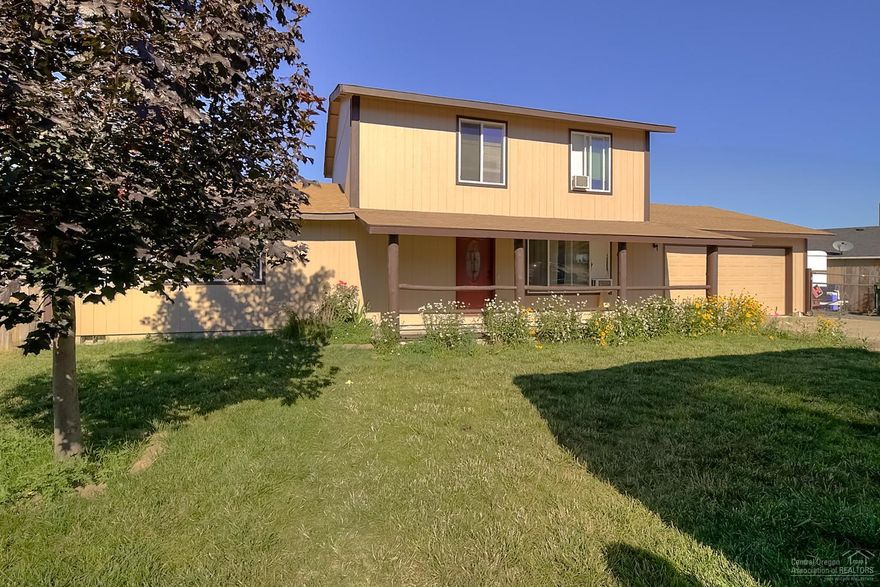 Enjoy incredible Mountain Views from within a quiet, family oriented community. Located near the park on a corner lot, this home is perfect for a family home or rental. Covered front patio, 1632 sf home w/3 lg bedrooms & Bonus Room that could be used as 4th br. Two bedrooms downstairs w/full bath on each floor. Functional kitchen w/tile accents. Spacious living area w/sliding doors to the back deck & yard. New exterior paint & roof, fully fenced & pet friendly. Minutes from Lake Billy Chinook & recreation.