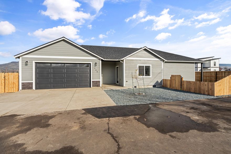 Pristine 2025 New Construction home nestled in the heart of Talent! Only minutes away from Ashland & near many landmarks! Settled on a generous 0.20-acre lot, this beautifully designed 3-bedroom, 2-bath home offers 1,654 sq ft of thoughtfully planned living space. Step inside to discover soaring 9-foot vaulted ceilings & an open-concept layout that effortlessly blends the kitchen, dining, & living areas—perfect for entertaining. The premium finishing touches will really showcase this home! Enjoy luxury vinyl plank throughout, granite countertops, tile showers, all electric appliances, central heating & cooling, & much more. The utility room and spacious laundry room add convenience to your everyday living. Every detail has been meticulously crafted to exceed expectations. Home is fully completed. Don't settle for standard when you can live in extraordinary!