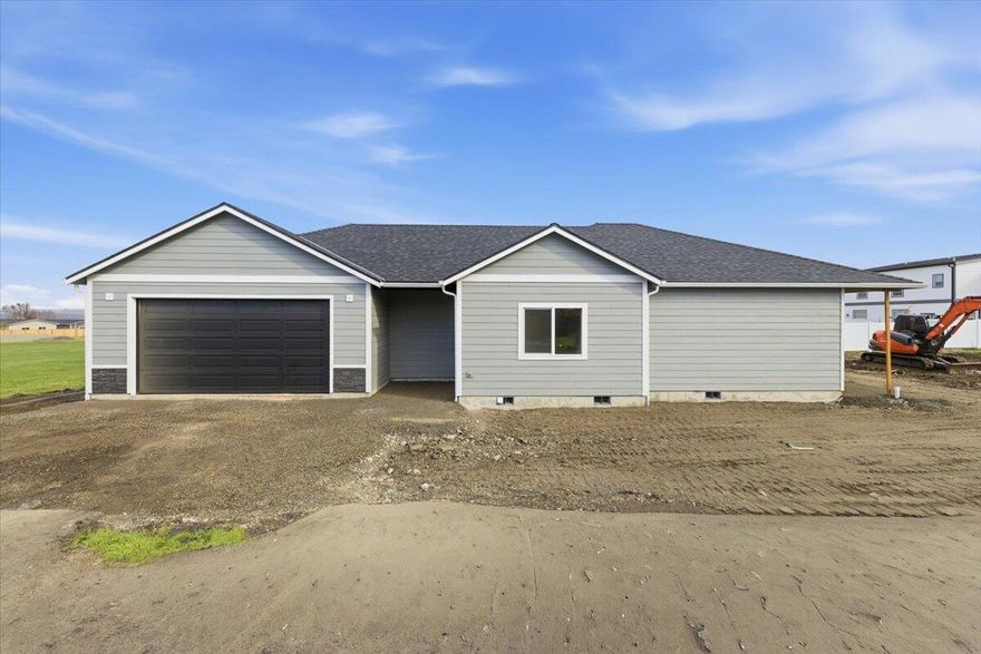 Pristine 2025 New Construction home nestled in the heart of Talent! Only minutes away from Ashland & near many landmarks! Settled on a generous 0.20-acre lot, this beautifully designed 3-bedroom, 2-bath home offers 1,654 sq ft of thoughtfully planned living space. Step inside to discover soaring 9-foot vaulted ceilings & an open-concept layout that effortlessly blends the kitchen, dining, & living areas—perfect for entertaining. The premium finishing touches will really showcase this home! Enjoy luxury vinyl plank throughout, quartz countertops, tile showers, an electric fireplace, central heating & cooling, a gas range/oven, & much more. The utility room and spacious laundry room add convenience to your everyday living. Every detail has been meticulously crafted to exceed expectations. There's still time to customize! Add your personal finishing touches before construction is complete & truly make it yours. Don't settle for standard when you can live in extraordinary!