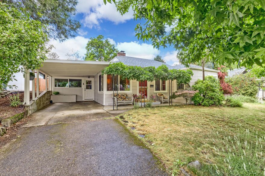 We have loved the charm of this home with its wood floors & arched doorways and the fireplace in the living room. Since we added triple pane windows & insulation, the home stays warm in winter & cool in summer. We've enjoyed gardening & spending time with family and our dogs in the sanctuary of the large, private fenced backyard with its flowering trees, shrubs, roses & many varieties of birds.  A favorite time is breathing in the sweet scent of flowing wisteria in spring on the front patio, taking in the partial view of the hills, and enjoying the family of deer who visit the front yard daily, often stopping to rest in the shade of the large, pink dogwood.  If we stayed, we would expand the kitchen & dining area, which easily could become a wraparound kitchen with potential for a second bathroom.  
This has been an ideal location for exploring the neighborhoods, easy access to the bike path & farmers market, and the many great open green spaces & and parks.