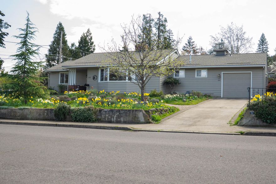 This highly sought-after one story, mid-century ranch style home located 3 blocks above-the-boulevard will be some lucky buyer's dream come true.  1st time on the market in over 30 years, this 3 bdrm, 2 bath, 2,091 sq ft home has been lovingly maintained & enhanced by its present owner.  Located on a .3 acre lot, the gently sloping front yard & level backyard have been beautifully landscaped to enhance its natural appeal & stunning views.  If location is the most important thing in real estate, this property is definitely at the top of the list:  close to town & the Ashland Plaza, easily negotiable lot, great sun exposure, privacy, & expansive feeling.  Spacious & bright living room with a gas fireplace, comfortable dining room, & another gas fireplace in the comfy den/family room.  The 3rd spacious bedroom has its own private entrance w/a bathroom ensuite.  Zone heating, 1-car attached garage, gracious back yard patio, veranda & pergola for entertaining.