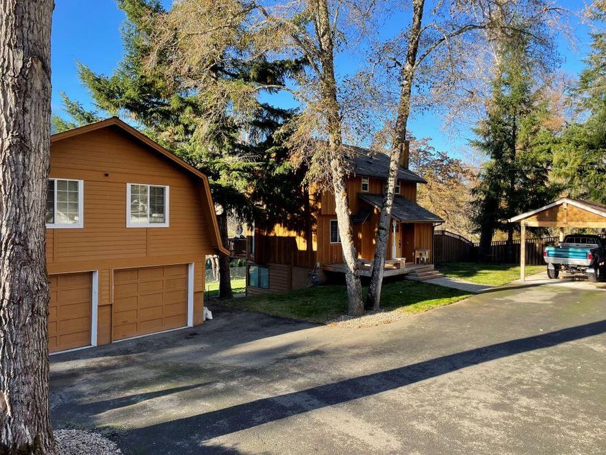 If you want to feel like you're on vacation while still at home, this is the place for you! This gem of a house is located in a gorgeous setting on Evans Creek, and only 1 mile from the Rogue River. It is tucked back off the road for extra privacy, but still within close proximity to town and I-5. The 2 bed, 1 Â½ bath home has a partially finished daylight basement and the oversized, detached garage has nearly 1,000 sq ft of unfinished living space above.