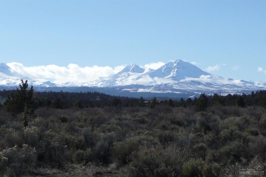 If your Buyer is looking for a vacant rural property with a Cascade Mountain view that has the wow factor this is the place. On a clear day 7 mountain are visible. It's close to public land for dog walking, horseback riding or what ever you enjoy. The property is flat with a natural landscaping. No need to drill a well Sun Mountain Community water is available, power is at the property line. Great location in the golden triangle easy short drive to Sisters, Bend or Redmond.