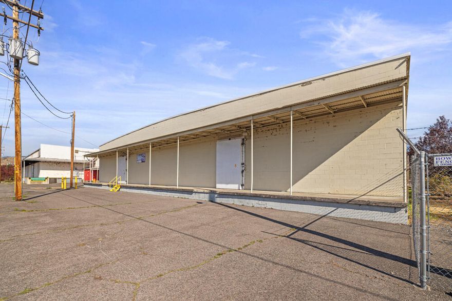 Dry storage warehouse for sale. Three separate spaces on one tax lot. Loading docks and fire sprinklers in north end unit. New membrane roof in 2024.  Located in an Opportunity Zone for tax advantages. Southern Oregon location along Highway 97.  No heat or water other than fire sprinklers. End unit has potential to be refrigerated (but not freezer).