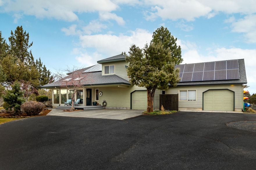 Enjoy amazing privacy and Cascade Mtn views on this acreage property only 11 minutes from downtown Bend and 5 to Cascade Village restaurants and shops. This two-level home boasts master on main level with two bedrooms, bath and loft upstairs. High ceilings greet you with a wide-open feeling and obvious quality throughout the house reflected by the warm radiant flooring, select grade cherry cabinetry, and the quartz countertops in a cook's kitchen! Watch deer in the yard but don't worry about your garden, it's protected by a deer-proof fence. The attached garage adjoins a shop area for use as additional parking/storage/workspace. Outside is your large yard with in-ground irrigation, ample deck for entertaining, room for guest/RV parking. A passive solar design, proudly built by award-winning custom home builder, Sunterra, makes this home very affordable to heat and cool.  You can try to beat this location but it will be difficult–a must-see.