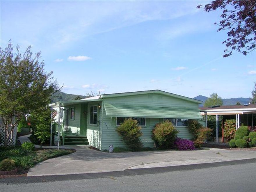 Immaculate home, kept in very good condition, in 55+ park. Covered porch on one side, carport with 10x8 storage shed on the other. Home is light and bright inside, has an island in the kitchen, and is in move in condition. Windows are double pane vinyl, and appliances have been updated. All measurements approximate.
