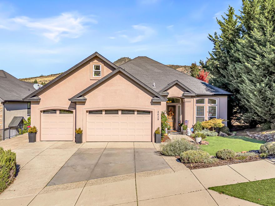 Discover exceptional living in this inviting 4-bedroom, 3-bath home, where comfort and convenience blend seamlessly. The spacious main-level master suite features its own cozy fireplace, offering a private retreat for relaxation. Step outside to enjoy a sparkling pool, beautifully raised gardens, and low-maintenance turfed yards—perfect for entertaining or unwinding year-round. Located in a sought-after neighborhood with easy access to local shops, parks, and top-rated schools, this property is ideal for families and professionals seeking both luxury and practicality.