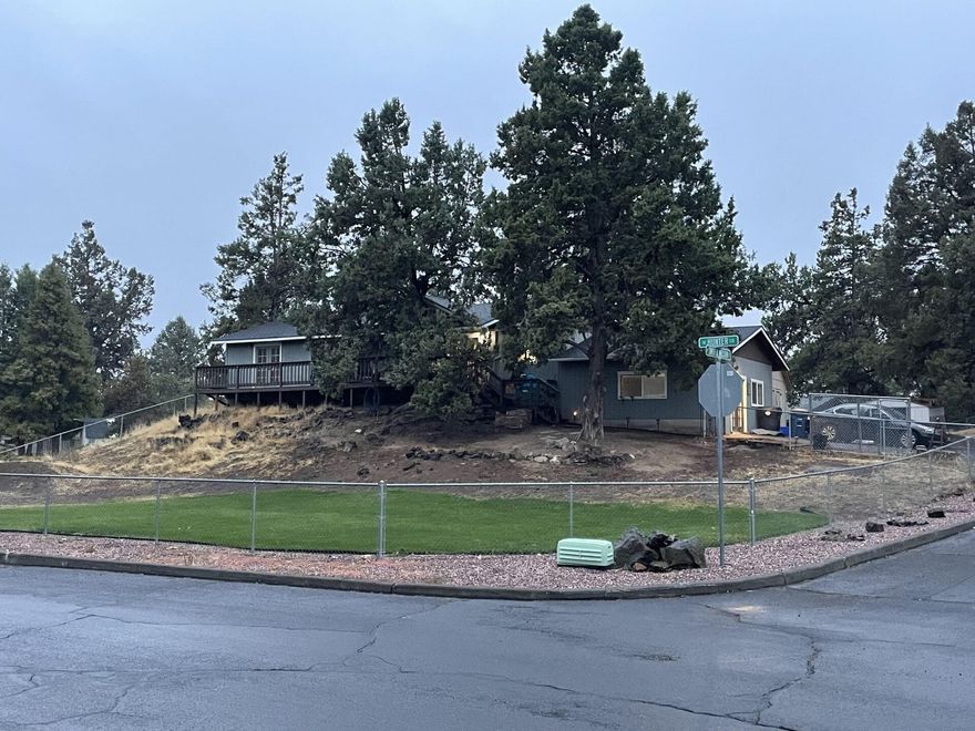 Great home that sits on .34 of an acre. Yard is fenced. Peek-a-boo Mountain Views. Close to shopping. Large 16 X 20 storage  shed for extra storage with shelves and two lofts. Sits on a cul-de-sac & a Corner lot.. Pellet stove to keep the home warm and  cozy.