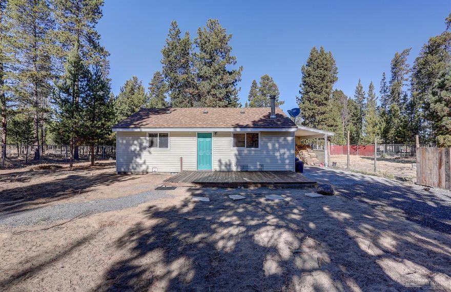 Quaint, quiet and cozy! This 1 bed, 1 bath home sits on just over 3 acres that borders BLM. The perimeter of the property is completely fenced so bring your animals or toys! Included on the property is a 896 sq ft shop with high ceilings suited for just about any project! Sit on the large front deck and enjoy nature. Hobby room attached to carport This home is a Must See!