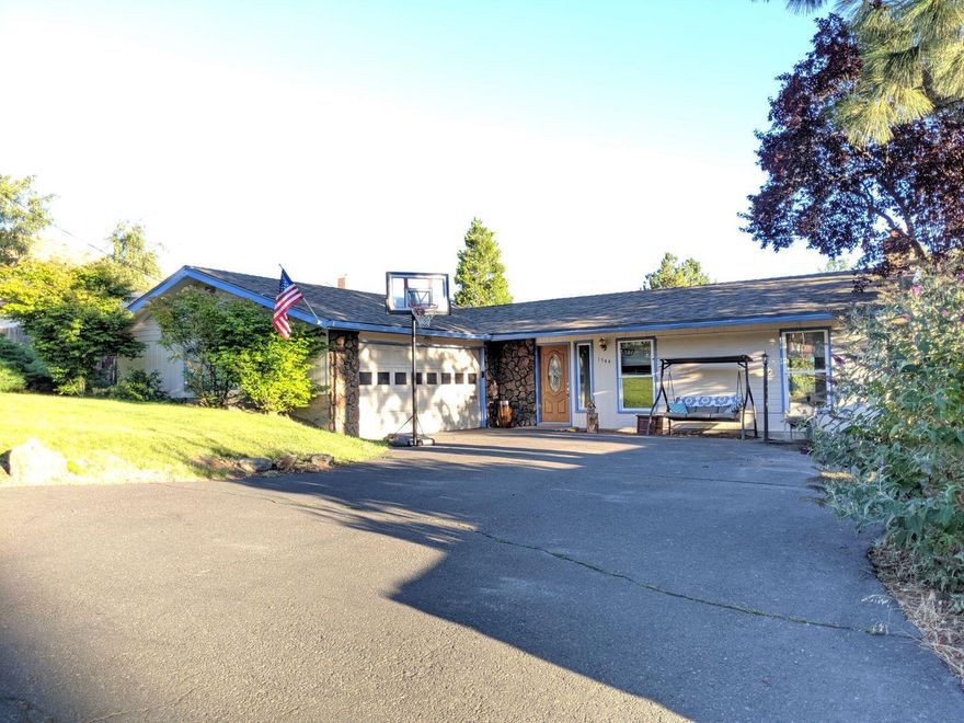 This outstanding ranch style home has so much to offer! Recently installed new solid surface laminate wood flooring, new roof, new HVAC system both heating and cooling, freshly painted with modern color schemes throughout the interior! The butler style kitchen works for functionality as well as for entertaining. Plenty of room to get the job done and also be a part of the action with the family and friends! The living room and family room are both large and offer two different areas, on either side of the kitchen, for separate space and functionality. The backyard is private with mature trees, but they leave enough open space to enjoy the peaceful summer breeze and take in views of Mt Shasta in the distance! Whether you're wanting a home in a great area for afternoon or evening walks...or looking for class and style, this home has it all!