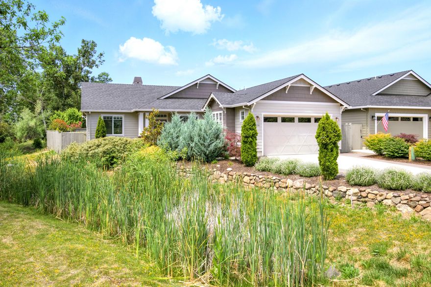 Quality built single-level home with an exceptionally convenient location in East Medford. Approx. 1766 SF + 2-car attached garage built in 2020, on .15 of an acre lot. A well-designed floor plan has the primary bedroom suite on one side and two additional bedrooms with a shared guest bathroom on the other. Spacious kitchen w/ pantry, custom cabinetry, stainless steel appliances and a large granite center island w/ eating bar overlooking the dining and living room. Attractive wood flooring throughout the main living areas and tile in the bathrooms & laundry. The living room has an impressive brick surround gas fireplace, coffered ceiling and access to the private backyard patio w/ fully fenced in yard. This is a premiere lot, beautifully landscaped and set within a quiet cul-de-sac neighborhood. Greenbelt on one side, access to pathways and views of the mountains in multiple directions, this truly is a serene setting to enjoy and sets this home apart from others!