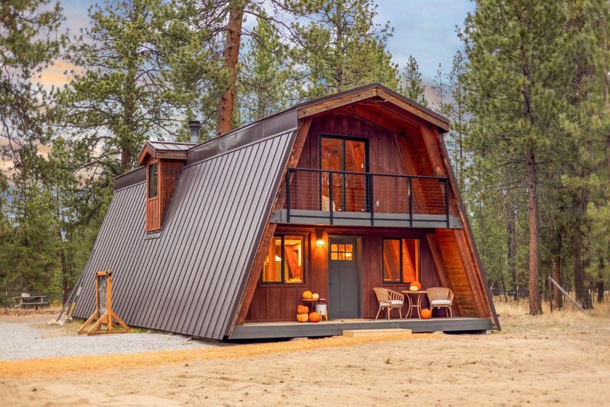 Welcome to 15622 6th Street — an impeccably remodeled A-Frame cabin on 2.5 usable acres in La Pine, Oregon, offering the perfect blend of modern comfort and rustic mountain living. This stylish 3BD/2BA home features soaring ceilings, open-concept design, and fresh finishes throughout. A detached garage/shop provides space for gear, projects, or toys for all your Central Oregon adventures. Enjoy your own private pond stocked with koi and goldfish and a charming tiny cabin ideal for guests, studio space, or added STR (short-term rental) income potential. Chicken coop, garden space, and room to build out your homestead vision. Minutes from lakes, trails, and recreation—yet private and peaceful at home. A-Frame getaway, vacation home, STR investment, or full-time retreat — the choice is yours. Discover the freedom of acreage living in the High Desert with a turnkey home that's ready for your lifestyle. Seller is a licensed agent in the State of Oregon.