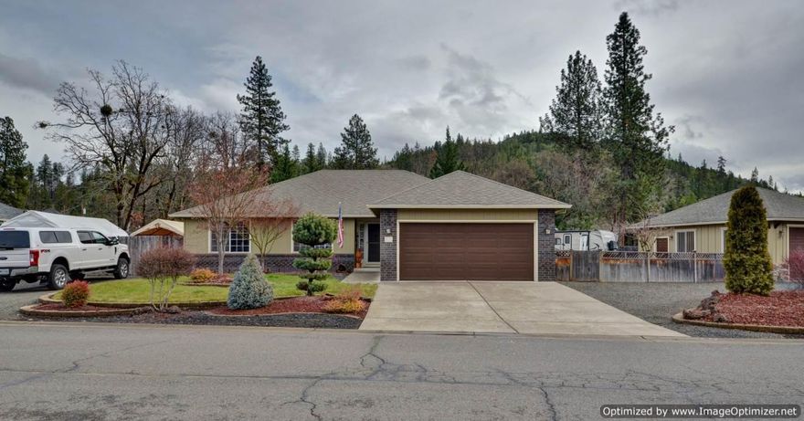 Drum Roll Please!! This immaculate home is a short distance lakes, rivers, fishing, hunting, and great hiking trails. Located in a quiet neighborhood this home sits on almost half an acre. Offering 3 bedrooms, 2.5 baths, hardwood floors, plush carpet with rubber pad underneath, vaulted ceiling, walk-in closet, certified wood stove, and lots of natural light- this home is move in ready. Lets not forget the mature landscaping, 2 2 car garages- one used as a man cave, abundance storage, 2 large RV parking areas- both areas you can fit 25+ ft RV's behind the gates, sheds, raised garden area, fire pit, and sprinkler system in both front and backyard. This home is a must see!