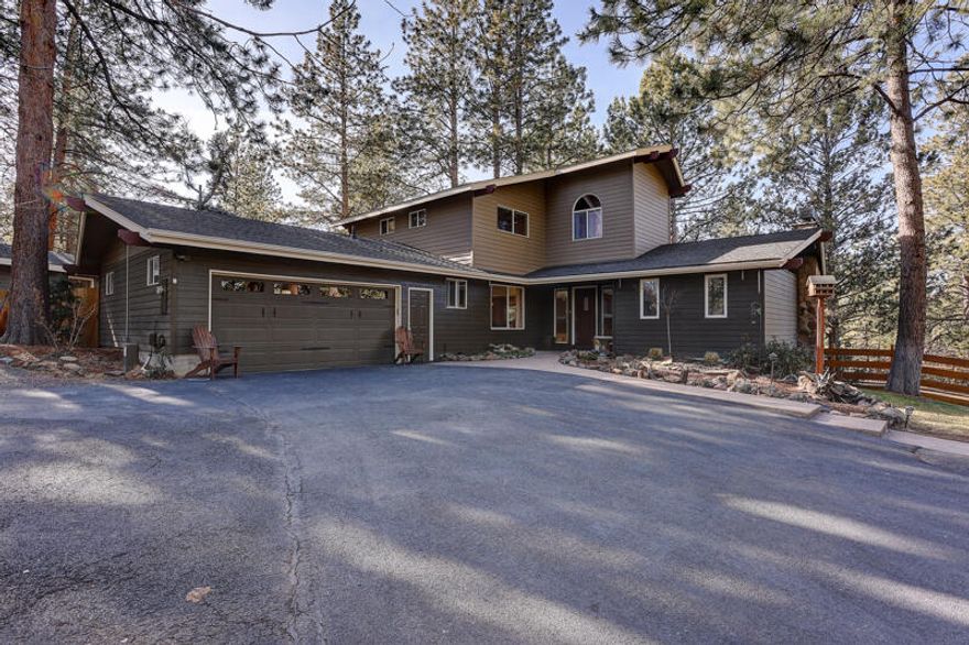 Looking for vintage charm in Woodside Ranch? This property is situated on 2.5 acres and includes two separately standing homes! The main house has 2,751 square feet of beautifully upgraded living space. You will find an open floor plan and some mid-century features such as a rock fireplace and sloped ceilings. The fully upgraded kitchen hosts concrete counters, island, and new appliances. There are four bedrooms, including the primary bedroom located on the main floor, 3.5 bathrooms, family room, space for home office or home gym and a two-car attached garage. And that is only the main house! This fantastic property also features a 952 square feet guest house! Here you will find a single level, one bedroom, one bath home with another full kitchen, one car garage and attached private deck. Outside the landscaping is mature and extensive, allowing for as much enjoyment outside as can be found on the inside of this home. This property is a treasure and will not be missed!