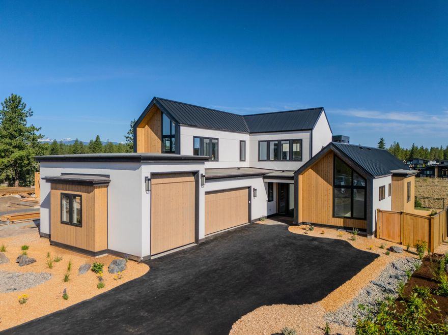 Introducing Curtis Homes' entry in the 2025 COBA Tour of Homes! This Scandinavian-inspired  beauty in Discovery West is the perfect blend of modern luxury and cozy charm. With 3,064square feet, 4 bedrooms, and 3.5 bathrooms, there's plenty of room to spread out and make yourself at home. The open-concept living area is seamlessly flows between the kitchen, dining, and living spaces. The kitchen is a chef's dream, featuring high-end appliances, a spacious island, and ample storage. The main-level primary suite is its own private retreat, complete with a spa-like ensuite bathroom, dual vanities, a walk-in shower,and a generous closet. Upstairs, two more bedrooms and a full bath offer privacy and comfort for family and guests. Need extra space? The bonus room is perfect for a home office, playroom, or fitness area. Outside, the charming patio invites you to kick back and soak in Bend's natural beauty. And with a 3-cargarage and plenty of storage, there's room for all your gear.