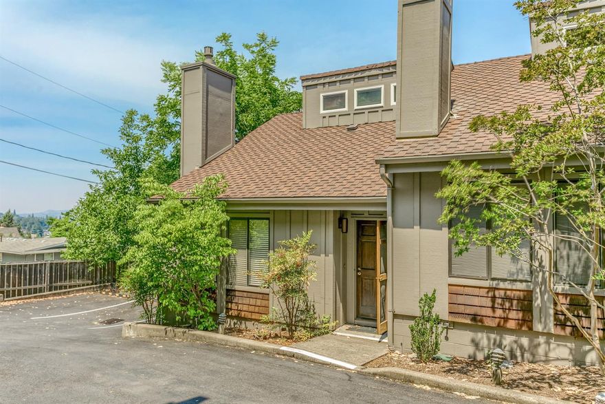 Contemporary style town home with views of the mountains and an incredible location, only steps from beautiful downtown Ashland, Oregon. Great floor plan with two separate living room areas, one with fireplace and the other has kitchen, full bathroom and another deck for outdoor enjoyment. The top level is a spacious bedroom with private deck and bathroom. There is covered parking, a large storage room and additional storage in the basement. The Ravenwood Townhomes are perched up above downtown, have guest parking, a pool and a well-run HOA.