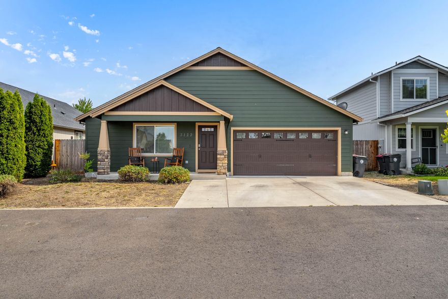 Appointment Only - Do not disturb occupants. Adorable Craftsman-style home in White City! This 4 bed, 2 bath, 1,400 sq ft gem sits across from a small picnic area and offers plenty of space and charm. Featuring an open-concept layout with a spacious living area, modern kitchen, and split-bedroom floor plan, this home is perfect for families or anyone seeking extra room. The entry welcomes you with laminate flooring leading to a spacious kitchen with granite countertops and stainless steel appliances. Enjoy a bright, open living room with natural light pouring in through the sliding glass door. Each bedroom is generously sized, including a front room with dual closets and a primary suite featuring a walk-in closet and private bath. Includes laundry room, 2-car garage, and a quaint backyard.