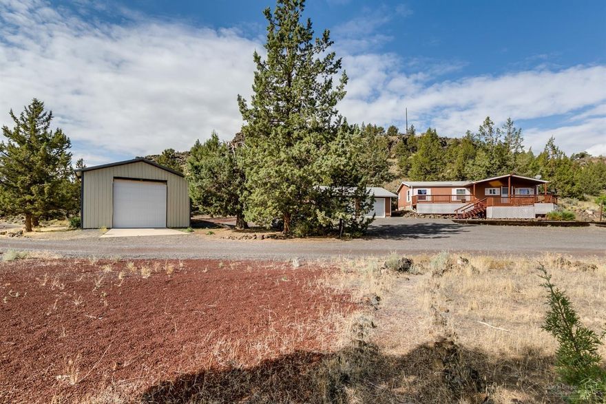 Fabulously quiet and tranquil setting, on a bluff above the Crooked River. Enjoy stunning scenery as the ight bounces off the canyon walls and a trout jumps from the rippling river. 9.1 acres with river frontage and only 1-nearby neighbor, that can't be seen from the house! Property includes 1344 SF nicely appointed home that is move-in ready, freshly painted inside & out, with new gutters, HP, ductwork, insulation & belly wrap under home, in addition to new carpeting throughout the living area. Don't stop there...the outbuildings are fabulous, including a large, roughly 200 sq ft storage/garden shed, a 180 sq ft enclosed porch, a double car garage, with 2 overhead doors and a 1152 sq ft RV building with man-door & overhead door. All the room you need for your toys is included in this beautiful 9.1-acre property. Call a REALTOR for a tour, before this fabulous property gets scooped-up! This property is simply enchanting!