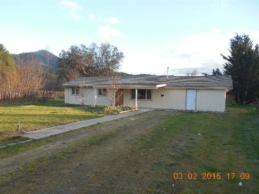 Amazing creek-front property. This 1.24 acre property has frontage on Evans Creek. The home has been beautifully updated with new interior and exterior paint, new carpet, and a new roof. The large level lot provides plenty of space for an RV or a boat. Listing agent is related to selling company's manager.