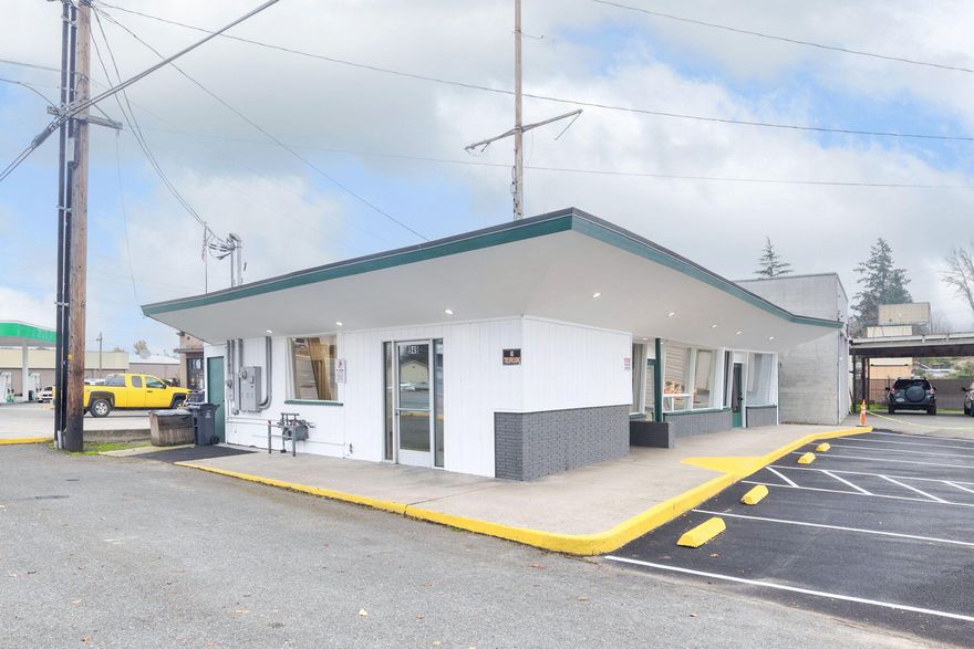 Great Exposure on Rogue River Highway. This 1750 sq ft commercial building is located on a 0.1-acre lot between a busy Shell Gas Station/Lil Pantry Mini Mart and a 76 Gas Station. The property is accessed directly off Rogue River Highway with six newly paved customer parking spaces, and two spaces for owner/staff. The building has recently been painted, and has new rolled torch down roof. Property has zero steps, accessible doors, and a male and a female bathroom. The site would be perfect for office, retail, or many multiple uses. Due to the high exposure and accommodating interior, could be a great property for relocation.  Currently vacant so easy to show.