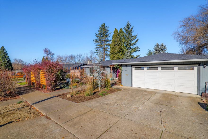 This single level home is in an established East Medford neighborhood near Rogue Regional Medical Center (Asante), doctor's offices, shopping, restaurants, and Rogue Valley Country Club. This is a gardener's dream with extensive plantings, multiple patio areas with three sliding glass doors to the private patios and gardens along with custom front yard fencing.  The interior of the home lives large with 2174 feet, 3 bedrooms, one primary suite with sliding glass door to gardens and a second junior suite, 2 full baths and 2 additional ½ bath, multiple living spaces with a terrific lighting, oversized great room with vaulted ceilings and extensive built-in bookcases, high-end display cabinets and overall endless storage.  New roof in 2022.