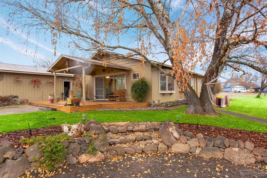 Affordable rural gem. Sitting on over 2 acres is this well built home. Located between the two table rocks, this turn-key property has 3 bed 1 bath, open kitchen/dining/living area, wood burning fireplace, central air, with views from every angle. Lots of privacy here as the property is fully fenced with security gate. The landscaping is mature with underground sprinklers, and lots of garden areas. The barn is a turn of the century wonder with great bones and is fully functional. Just a few short miles from downtown Central Point on a quiet and seldom traveled road. Don't miss this one!