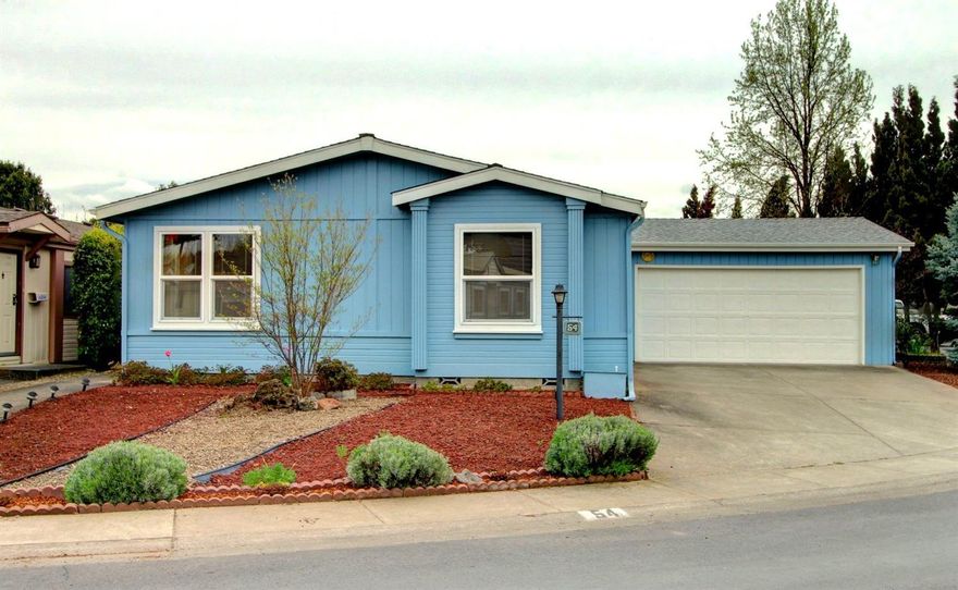 Extremely Well Cared-For Golden West Country Estate Manufactured Home in the Very Desirable Meadows 55+ Park. This gorgeous 1991 model home sits in a spectacular location in the park, with an open area next door for extra room and convenient low-maintenance landscaping front & back. This is one incredible home with vaulted ceilings, a huge living room with tons of windows to let in the natural light and beautiful crown molding, 2 bedrooms plus an office (easily a 3rd bedroom), a 200 sq. ft. (approx.) enclosed sunroom with heat & air, and 2 walk-in closets! This rare opportunity comes with a 2-car finished garage, an extra storage shed in the back yard, and tons of updates including new carpet, newer counter tops and newer forced-air heat & A/C unit. Extremely convenient to Shopping and Medical, this park features a new swimming pool and tons of extra amenities! All this, and the Fridge is included, don't miss it!