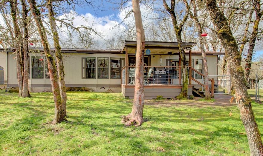 Enjoy country living and room for your horses with the convenience of being close to town! This beautiful 2 bedroom, 2 bath, 1,224 sqft home is located on 5 usable acres featuring a riding arena, 4 portable horse stalls with rubber mats and is fenced and cross fenced. The home welcomes you in to the spacious kitchen with plenty of cabinet space, newer appliances and peninsula bar with seating. The large open living room features vaulted ceilings, large windows with an abundance of natural light and adjacent dining room. The Master bedroom is open and features a large walk-in closet, jetted soaking tub, dual sinks & stand up shower! The second bedroom is roomy and offers tons of natural light and plenty of closet space. The 5 acres are all usable and the granite base, sand topped riding arena is perfect to ride your horses in. With a new metal roof, detached two car garage with workbenches & plenty of room for your toys & Horses, this property won't last long! Home warranty included.