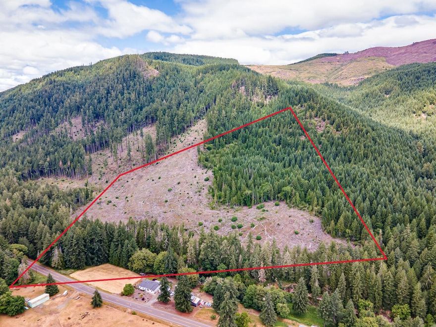 Boasting nearly 1,000 feet of scenic Sharps Creek frontage and paved road access, this property is perfect for a private recreational retreat. The land features a mix of terrain with recently harvested and replanted areas alongside mature timber, inviting exploration and outdoor enjoyment. Wildlife is abundant—deer, elk, bear, and birds frequent the area. Less than a mile away, the Sharps Creek Recreation Site offers additional opportunities for adventure, along with nearby trails, waterfalls, and public parks. Bordered on two sides by BLM land, the property feels secluded yet connected to vast wilderness. Whether camping, hiking, or simply relaxing by the creek, this is an ideal basecamp for year-round recreation in one of Oregon's most scenic areas. Neighbor encroachment present - Buyers to perform due diligence and assume responsibility for any necessary resolution.
