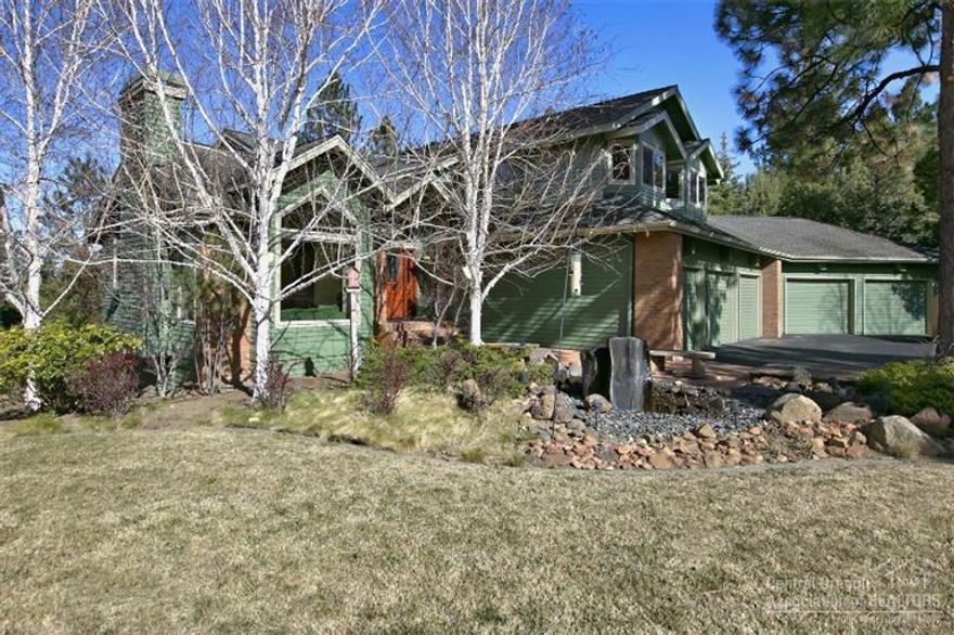 Awbrey Butte home with Cascade Mountain views. The home features lots of big windows, a gas fireplace in the living/family rooms, main level den with built-ins, & a wet bar. The master suite features a spacious bathroom with a soaking tub. One of the bedrooms would work well as a media room. The 5-car garage, with storage & shop area, is a car buff's dream. Sit out on the west facing covered deck or enjoy the hot tub. There is even a three-hole putting green. The beautifully treed corner lot offers privacy.