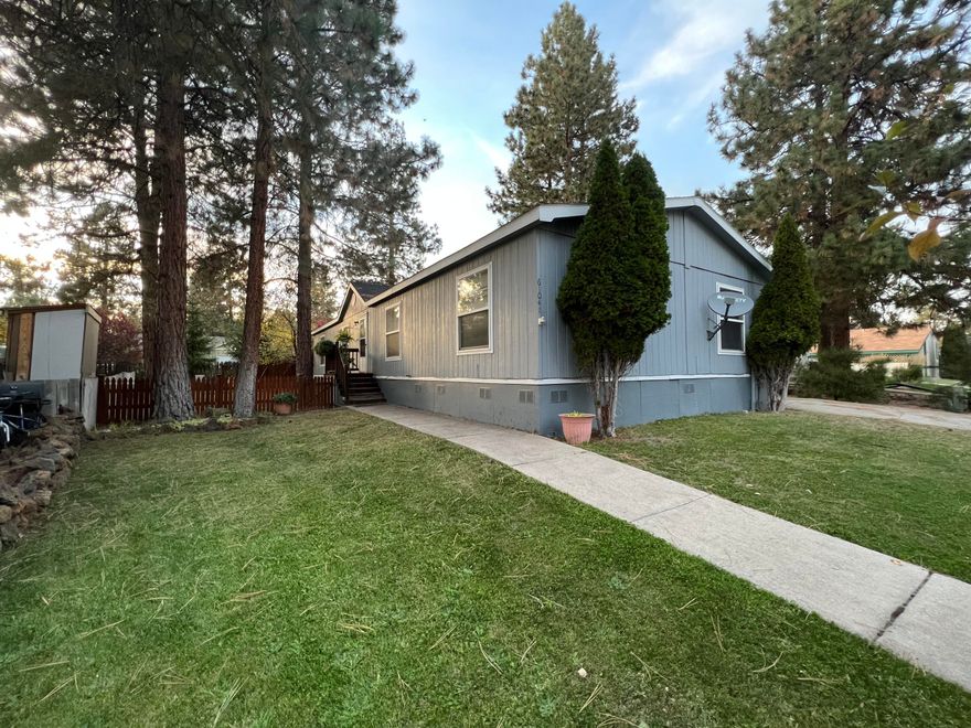 Tucked away in a cozy neighborhood in SW Bend, you will find this well taken care of home! This home is located not far from Old Mill, Deschutes River, the Factory Outlet and so much more! With 4 bedrooms and 1,755 sqft you have plenty of room for guests, an office, pets and kids. Some of the many features include a newer hot tub, detached carport, 2 storage sheds, a new roof in 2014, freshly painted kitchen cabinets, updated flooring, pellet stove and a spacious laundry room. Space fee includes a playground, club house, water, sewer, and snow removal.