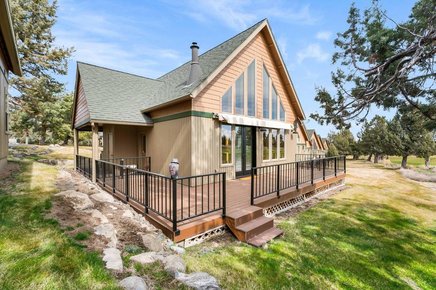 Nestled along the 5th fairway of The Ridge Course in Eagle Crest Resort, this meticulously remodeled furnished three-bedroom, two-bathroom chalet offers 1,356 square feet of refined living space. 

Soaring vaulted ceilings, warm knotty pine paneling and distinctive log accents. The kitchen showcases sleek quartz countertops, gleaming stainless steel appliances, and a custom coffee bar.
A built-in wet bar with beverage refrigerator and a cozy window seat make entertaining guests a breeze.

Recent upgrades include a new pellet stove insert, Pella French doors, and south-facing windows that flood the space with natural light. The Trek deck and fresh exterior paint (2024) enhance the home's curb appeal, while a Sunsetter awning creates the perfect outdoor retreat.

The luxurious primary suite offers premium amenities including heated tile floors, steam shower with aromatherapy features, custom shutters, and thoughtful built-ins. A separate HVAC system ensures personalized comfort.