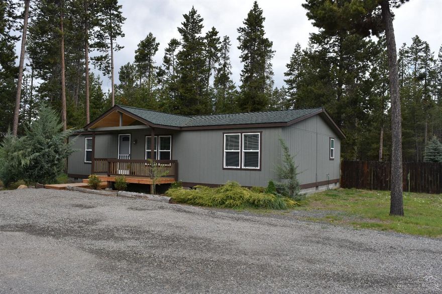 Come take a look at this adorable updated 3 bedroom/2 bedroom manufactured home on a .53 acre corner lot. All new: laminate, carpet, tile flooring, composition roof, exterior & interior paint, windows, & window blinds. In the kitchen: new refrigerator, microwave, dishwasher, kitchen cabinets, counter top, and tile back splash. Beautiful double sink vanity in master bath. Plenty of room for a greenhouse, gardening, backyard entertaining. Detached two car garage. Listing agent is related to owner.