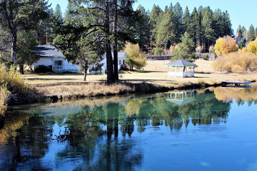 Riverfront! On the Williamson River is where you'll find this Spacious 3 Bed/2 Bath Home situated on 1.94 acres. The Kitchen Opens to the expansive Living Room, with a wall of Windows to gaze out to the River & surrounding Hills! Wood Floors, Vaulted Ceilings, Custom Design. The Master Bedroom with attached full Bath opens to the full length Deck. Attached is a 2 car Garage, as well as an RV pad with power & water. There's a lovely Gazebo on the back Lawn & the Boat Dock reaches in to the River, home to world renowned Trout fishing. The property is fully fenced and consists of (2) lots. The Circular Driveway allows for easy access & the extra lot provides options for improvements. Residents of Pine Ridge Estates Unit 1 have a walk easement to walk or fish along the vast River frontage. Make an appointment today to view this River property, located just 30 minutes North of Klamath Falls & close to Crater Lake Park for year-round adventure!