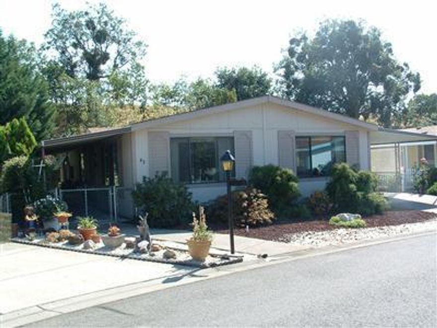 Great Home in a Great Park. This home is very well maintained & clean. Yard is low maintenance & is completely fenced. Home is on a large lot in private area of park. There is a large attached shop with plenty of storage & work bench.