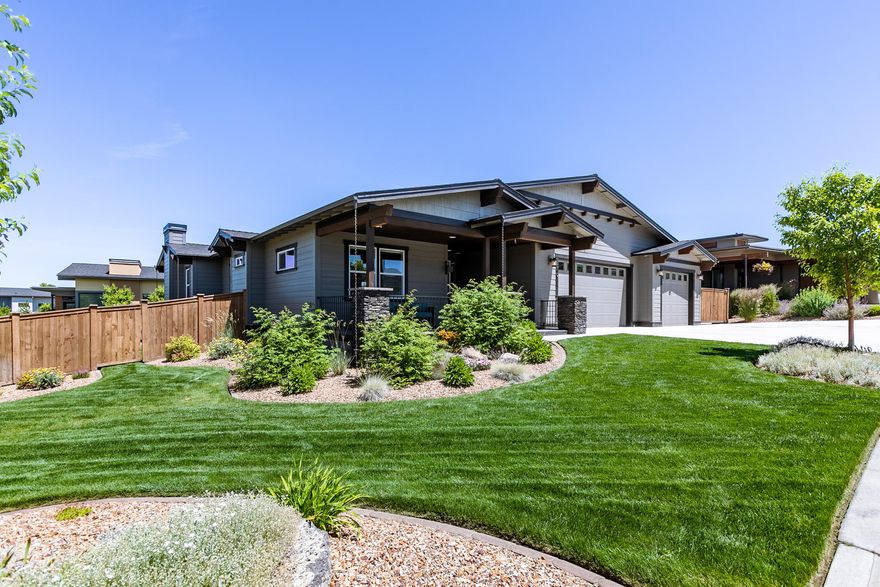 First time on the market! You will enjoy everything about this one level open floor plan home in Red Tail Ridge.  3 Bedroom 2 Bath home features extensive laminate flooring in high traffic areas, Gorgeous custom kitchen with Slab Quartz countertops, Stainless Steel suite of Kitchen Aide Appliances, Custom Tile back splash with under counter lighting.  18 X 13 Master bedroom with walk in closet and step in custom tile shower. Surround sound in great room, Master and rear patio areas. Barn Door accents the entry to the guest suite area of the floor plan.   30 X 37 Attached Three car garage.  14 X 28 Concrete RV parking.
Inviting Covered front porch with raised pavers, and large back raised paver  patio off the rear of the home. Fenced and beautifully landscaped. Peek a boo mountain views.