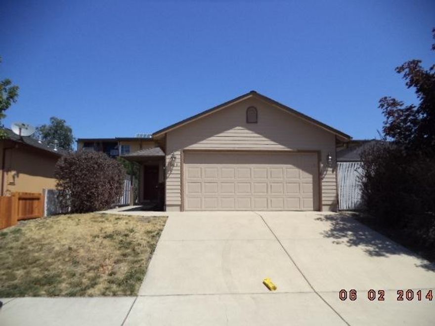 Vaulted ceilings, great views, oak cabinets, close to schools! Offers a country feel, just on outskirts of town. Three bedroom and two bath all on one level. Easy to see! This is a Fannie Mae HomePath property.