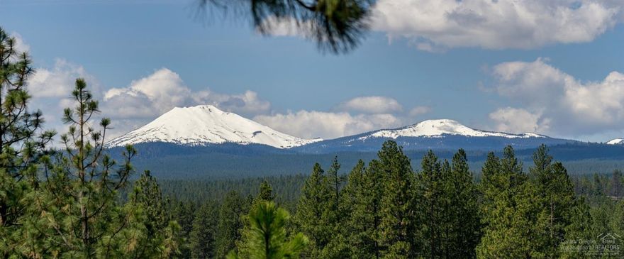 One of a kind property, setting and location w/unobstructed Cascade views from Mt Bachelor to North Sister. This 5.81 acre Westside parcel is nestled among mature pine trees & boarders Forest Service land, yet just minutes from Downtown Bend, Old Mill, Tetherow, Mt Bachelor and a short distance to the river trail. This one owner, custom home was built to bring the serene outdoor setting in with large picture windows, vaulted ceilings, skylights and exposed beams. Enjoy stunning sunsets and panoramic views from almost every room in this home. The expansive deck extends the length of the entire home and offers easy access from nearly every room. Cozy up in the living room to the wood-burning fireplace. Plenty of room for all of your toys and hobbies with a oversized 2-car attached garage and a detached 28x60 covered shed & shop. This is a very rare property with no HOA! Come create your own Westside Estate.