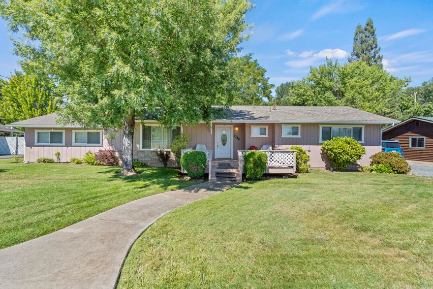 Welcome to 1340 Oija Ave, a charming residence on the outskirts of Grants Pass. Nestled on a well-manicured lot, the exterior exudes curb appeal with its tasteful landscaping, mature trees, and a welcoming front porch. As you step inside, you are greeted by an open and spacious living and kitchen area. The property boasts a large shop that has several divided areas. Inside the shop there is a living area with its own bathroom. Towards the rear of the property, there is a carport that can be used for RV storage. There are RV hookups on the property. To top it off the home sits on a spacious half acre parcel. This home wont last long, schedule your private showing today!
