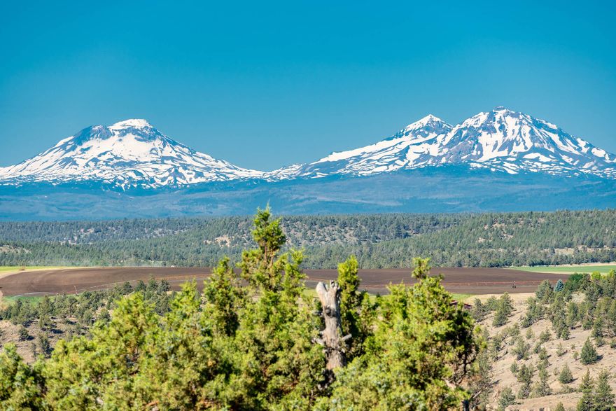 Unsurpassed Cascade Mt & Deschutes River Canyon view!  Rim property adjoining public land, to water-front, preserving views of both the Cascades & the Deschutes River.  If you are a hiker, the trailhead adjoins this property & will take you down into the Deschutes River Canyon, or along the rim for miles & miles!  If not, just enjoy these stupendous views while sitting on the deck under the Sunsetter-awning or viewing through the picture windows of this quality 2034 sq ft home.  Do you have an indoor hobby?  The 20'X20' attached multi-purpose room will bring a smile to your face!  720 sq ft, 2-bay detached garage gives you plenty of room for a shop; and the 150 sq ft accessory building is finished, complete w/power.  Having extra company? They may want to camp-out in the yurt!  With all of this, there is still room for the animals, w/ pasture, animal shelter & hay storage!  So much to enjoy!  And the lights at night will not be from your neighbors TV; but from a 1000-stars in the sky.