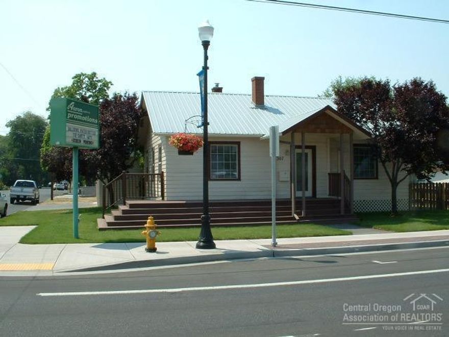 Prime downtown location. Lots of updating. Potential Home/Business combination with high traffic count. Commercial zoned. Excellent signage. New sidewalk, pavers, street trees and landscaping. Front yard automatic sprinkler system, lots of building and potential for the money. Come See!!!