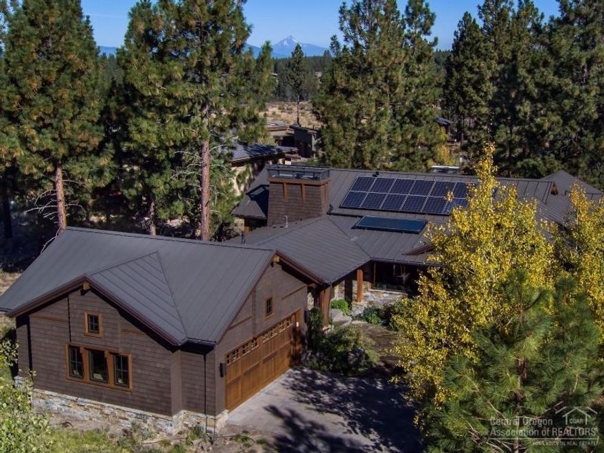 Imagine living in perfect harmony w/nature! Stunning custom home blt by Greg Vendrome in exclusive Shevlin Commons w/Cascade Mtn views. Open great room plan w/concrete floors & radiant heat. PV Solar. Kitchen designed by Kirsti Wolf is a chef's dream. Sub Zero, Wolf appliances, honed granite counters w/onyx back splash. Copper FP, beautiful blt-ins & a pizza oven. Gorgeous master w/wood barrel ceiling. West side, close to Shevlin Park, trails, & downtown. Wonderful landscaping w/outdoor FP & water feature.