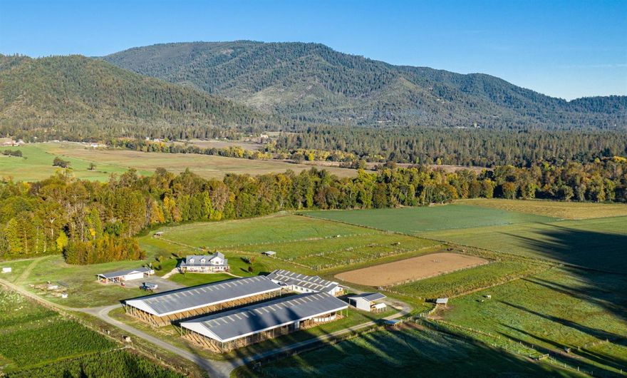 The 37.55-acre ranch offers water rights for 24 acres, prime soils for agriculture, level to gently rolling topography, great views and over 1,000 feet of frontage on year-round Williams Creek. The state-of-the-art custom home with Insulated Concrete Form Construction (Estimated to be R90 insulation rating) built-in 2006. The farm-house style design features a floor plan that includes 3,906 Sq. Ft. of living space and over 2,500 Sq. Ft. of covered wrap-around deck providing the owner with a luxurious and enjoyable place to call home. The ranch's infrastructure includes the main horse barn, training barn, covered riding arena, shop and hay barn, all totaling over 50,000 Sq. Ft. under roof. The buildings are in pristine condition and could be well suited for other agriculture uses as well. Level to gently sloping irrigated pastures with forest, mountain and big sky views in every direction. Irrigation Pump and Equipment Included. Good well with a constant pressure pump system.