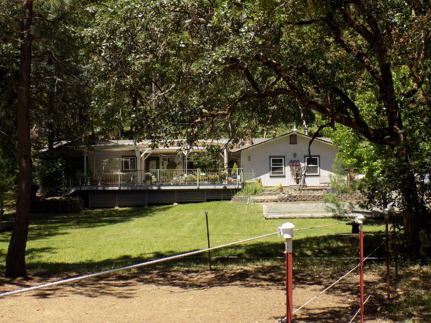 If's it a beautiful horse property you are looking for, welcome to your own oasis! For the horse enthusiast, this property has a pole barn, acres of horse trails, an equestrian obstacle course, regulation mounted archery range, fenced arena, round pen and plenty of pastures. All this and a beautiful, private 2/1.5 Ranch style home on 19.56 acres. Property is set up for horses, but the possibilities are endless. House has a newly updated kitchen with Corian counters, formal dining room, living room and insulated and finished three car garage. The covered deck out front offers stunning evening views and is perfect for relaxing in the spa and entertaining. Plus a large fenced garden, seasonal creek with a walking bridge over it and a pond add to the beautiful of this property. Do not let this one get away.