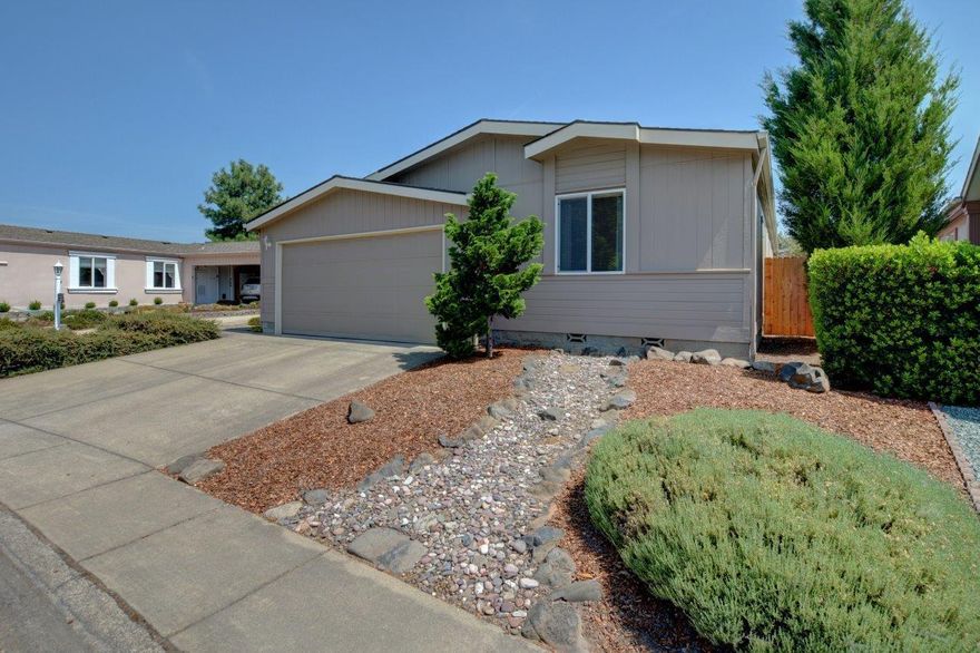 Triple wide manufactured home in a 55+ park offering 3 bedrooms and 2 full baths.  This home has a great floor plan, including a Jack and Jill bathroom, the large living space, plus the primary walk in closet are just the beginning of all the great features this home has. While the property boasts of exceptional care inside and out you also get to enjoy the community pool house, courtyard, walking trails, and so much more.  Out back on the covered patio you will find heritage 80 year old grapes, and a storage shed.  Schedule your showing today.