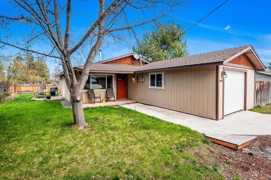 Beautifully updated single level home where pride of ownership shows throughout. This home features stunning kitchen remodel with updated cabinets, stainless steel appliances, granite tile counter-tops, laminate flooring throughout home, cozy wood burning fireplace in living area, wood wrapped windows and doors. Master bedroom includes walk in closet with double doors to back patio. Enclosed RV parking and just two houses from Dry Canyon walking paths. This home shows like new! Don't miss out on this one.