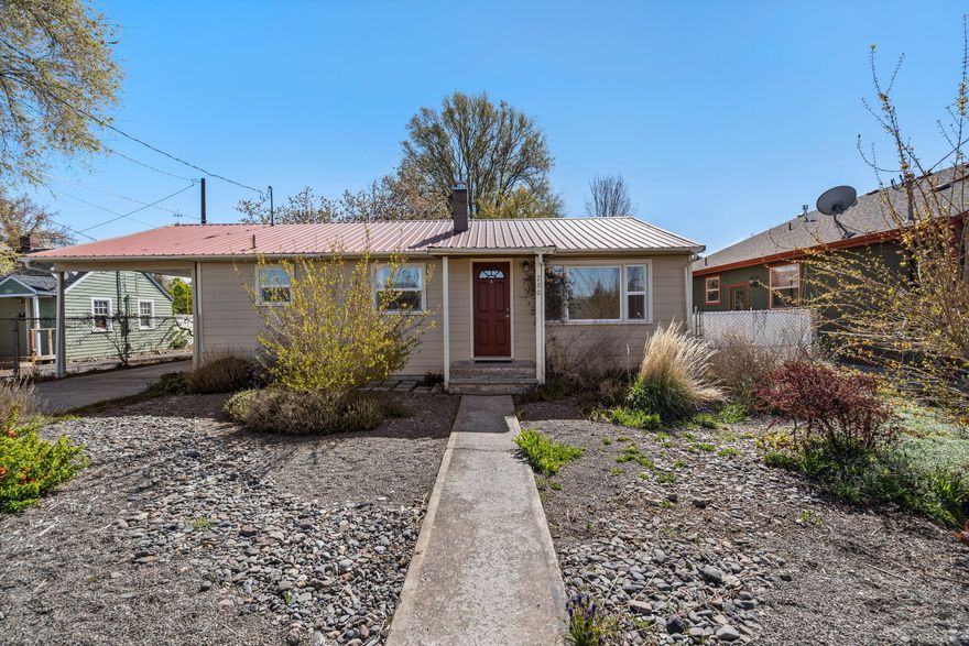 Charming cottage in the heart of Prineville. Don't wait to see this 2 bedroom, 2 bath renovated home w/updated flooring, trim, windows, kitchen, siding & gas stove. Light, bright & full of character! Built ins, shaker cabinets, nice appliances including gas range & refrigerator. Outside is a gated carport, back covered patio that is perfect for entertaining. Separate building in the back of the property is a charming cottage (not included in the sq footage) that could possibly be used as an ADU (check with city) or office, art studio, guest quarter, your creativity awaits! Newer siding, roofing and exterior paint. Additional storage shed with power for workshop or potting shed. Large backyard with custom fire pit area, raised flower beds, fruit trees, raspberries, strawberries, rhubarb & tons of low maintenance flowers & trees. Non-potable well for irrigation. This home as it all. Located blocks from the historic courthouse & directly across the street from Davidson baseball fields.