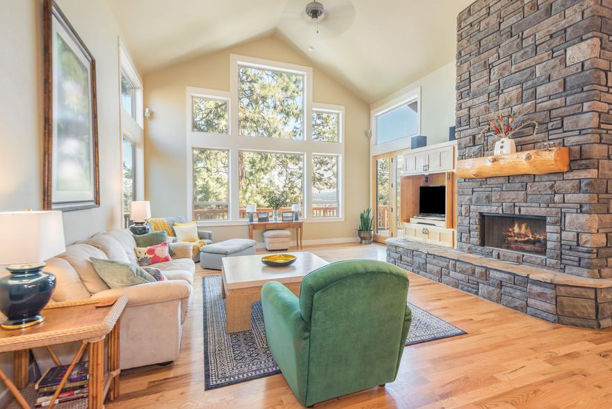 Take a look at this beautiful quality built home with gorgeous easterly views from almost every window. Enjoy your large deck with your cup of coffee in the morning & your cocktail in the evening & take in the beauty of Bend Oregon. The expansive living room windows, tall vaulted ceilings, large floor to ceiling stone fireplace really make a beautiful statement. You will love this open floor plan, & open kitchen with large pantry. Spacious rms, 3 beds, 2.5 baths PLUS an office. Plenty of room for family. Lots to love about this easy care home.  This NW Mountain feel home with elegant touches has a large primary bedroom on the main level with access to the expansive deck & a luxury en-suite bath that includes a large tiled walk in shower, walk in closet, jetted tub, travertine finishes, & double sinks with lots of counter space. Low maintenance yard, heated driveway, triple car garage, privacy & more are all a part of this lovely Bend dream home.