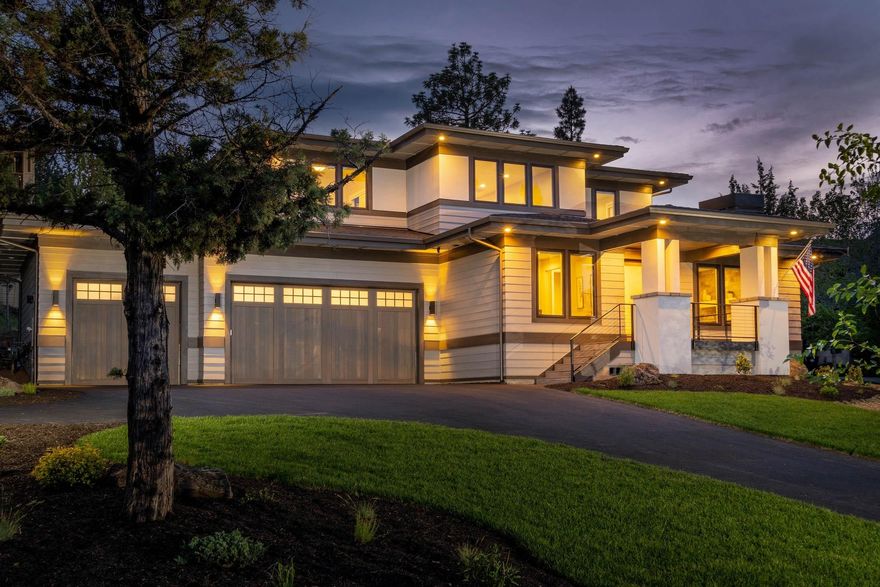 Stunning custom home by Central Oregon's Fusion Home Builders tucked away in NW Bend's coveted Awbrey Park neighborhood. Exquisite great room featuring an expansive chef's kitchen w/Dacor appliances, towering custom cabinets, large dining area, floor to ceiling stone fireplace surround, casement low-e windows, & beautiful wide plank engineered hardwood floors throughout. Main level office lies quietly tucked away behind a custom contemporary barn door. The spacious main level master includes coffered ceilings, an expansive master bath including heated floors, double vanity, soaking tub & walk-in shower. Upstairs features Northeasterly views, an en-suite for guests, plus a third room, & generous bonus/media room. Enjoy the sprawling backyard w/ large paver patio and sizable lawn. Other notable features include an XL 3-car garage w/ 9ft doors & epoxy flooring, central-vac, smart lighting & irrigation systems, built in speakers, humidifier, & hybrid tankless/tank hot water system.