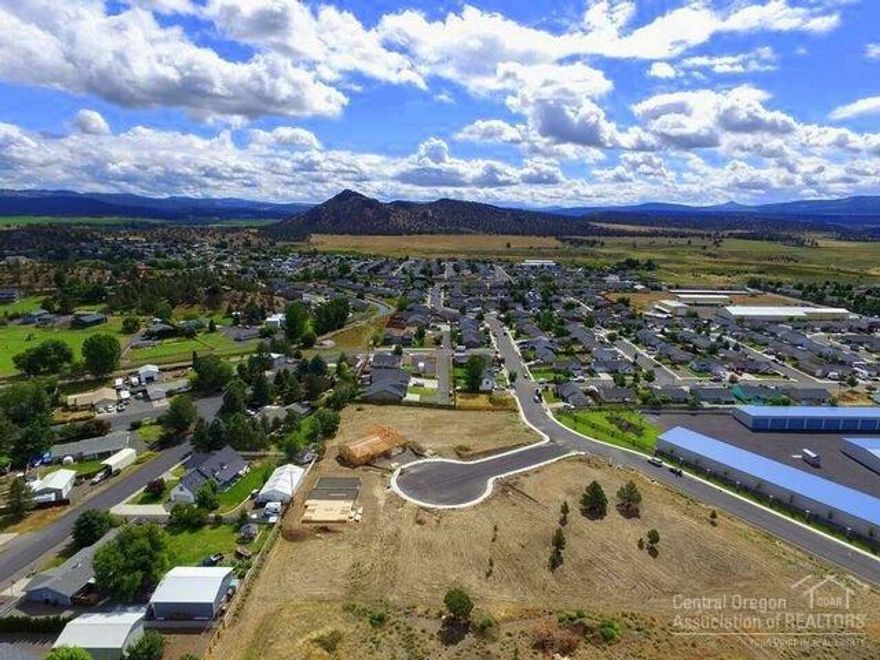 It's new in town! Black Bear Court subdivision with views of Barnes Butte. Spacious 10,233sf lot with city services - paved road - No HOAs - No CCRs. Great location with room for shop & toys. Additional lots available. CLA for owner terms. Come check us out!